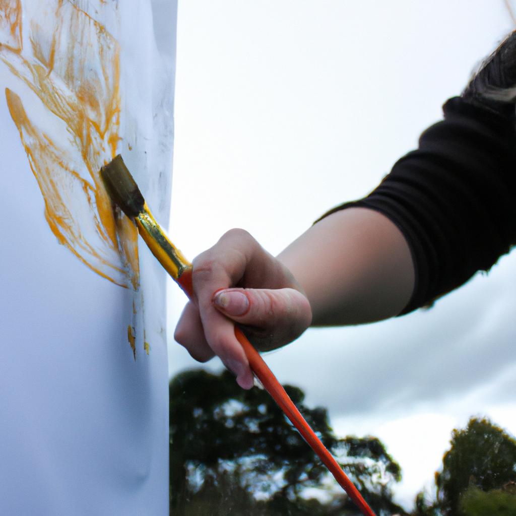 Person painting with paintbrush